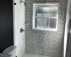 3/8” clear tempered glass with brushed nickel 2 x 2 clamps