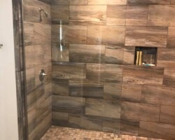 3/8” clear tempered glass with brush nickel channel and vertical support bar