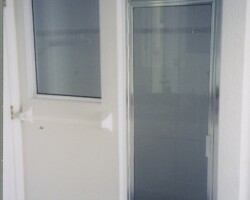 3/16” clear tempered glass with chrome channel on all sides (door is framed clear glass with chrome frame)