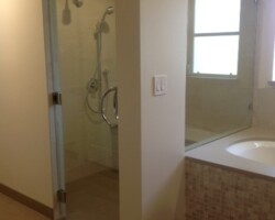 1/2” clear tempered glass fixed panel with chrome 2 x 2 clamps (door is frameless with custom bore thru handle)