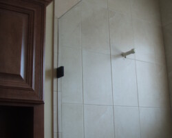 2/8” clear tempered glass with oil rubbed bronze 2 x 2 clamps