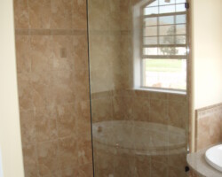 1/2” clear tempered glass with oil rubbed bronze 2 x 2 clamps