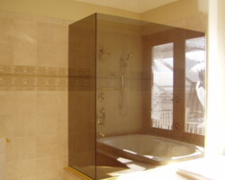 3/8” tempered bronze glass with 90 degree angle and gold channel