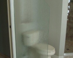 3/8” tempered rain glass with clipped corner and chrome channel