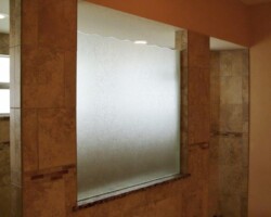 3/8” Delta Frost fixed panel with custom wave top and brushed nickel side u channel