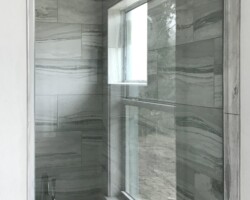 3/8” clear fixed panel glass with chrome u channel on sides and bottom