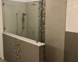 3/8” clear fixed panel glass with brushed nickel clamps