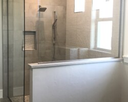 3/8” clear glass fixed panels with brushed nickel channel on 2 sides
