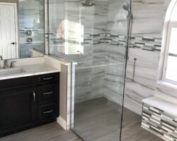 3/8” clear one piece fixed panel with knee wall notch and brushed nickel channel (mirror also notched for knee wall)