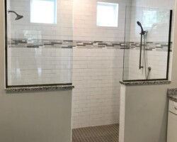 3/8” clear fixed glass panels with brushed nickel channel on 2 sides
