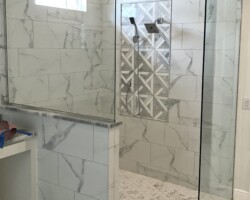 1/2” clear glass fixed panels with chrome channel on 2 sides